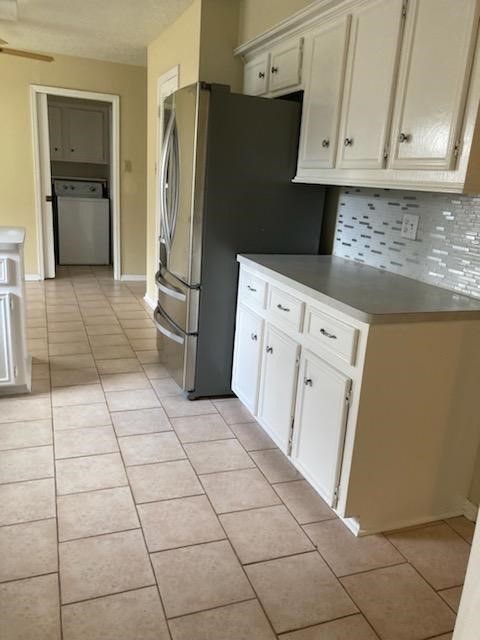 1709 Beaver Springs Court Houston, TX 77090 - Photo 3 of 11 a kitchen with granite countertop a refrigerator a stove a sink and dishwasher