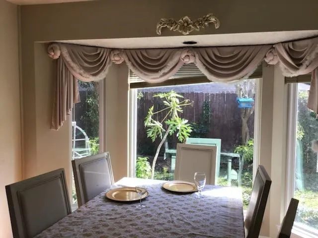 a view of a dinning room with furniture window and wooden floor