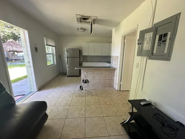 a view of an empty room and a window