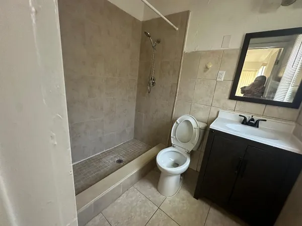 a kitchen with a refrigerator a stove a washer and dryer