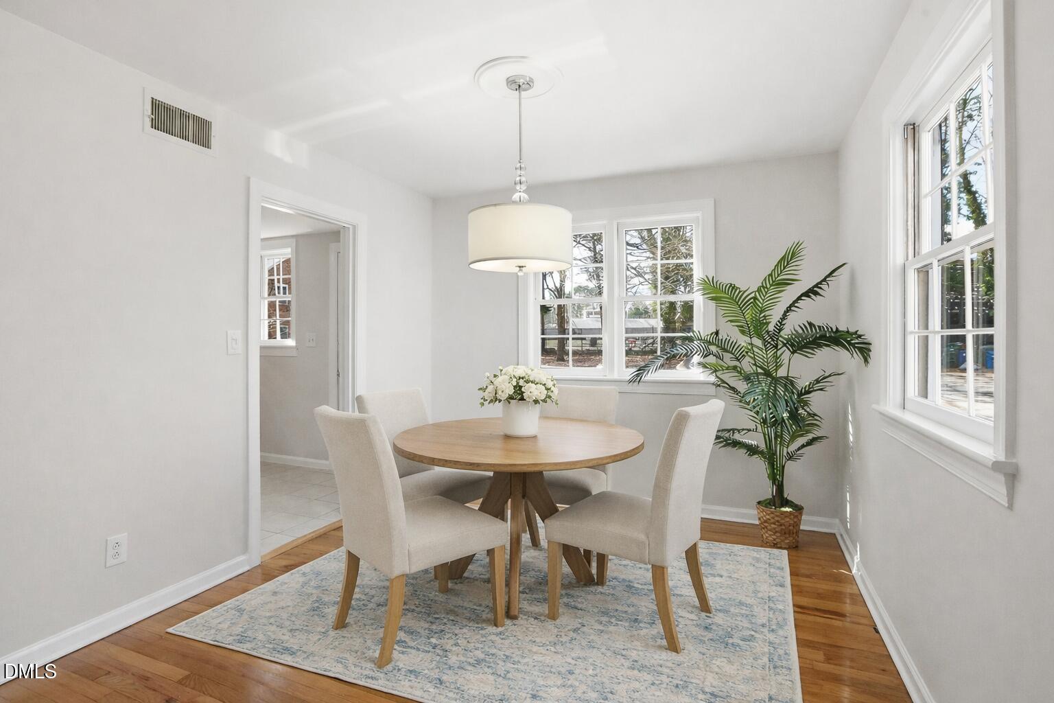 933 St Marys Street Raleigh, NC 27605 - Photo 4 of 34 Inviting dining room with floral centerp