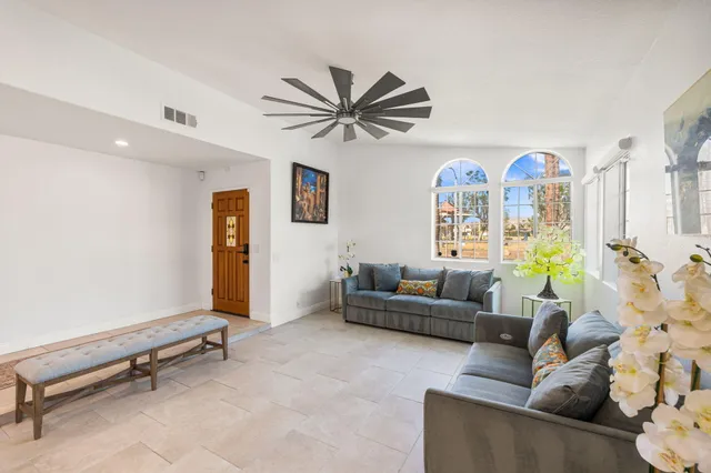 a living room with furniture and a table