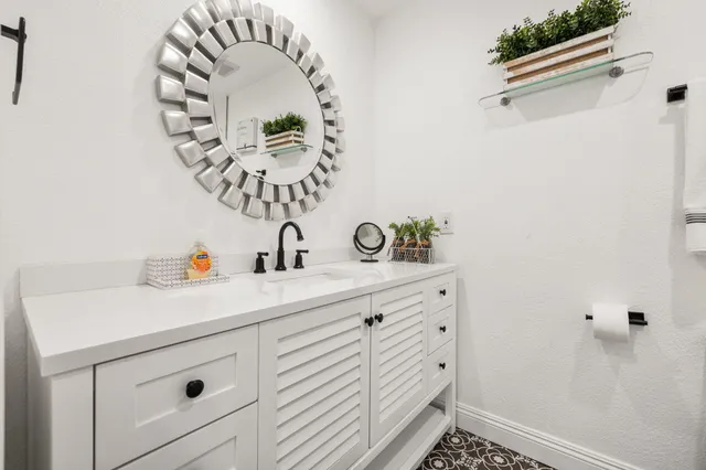 a bathroom with a sink and a mirror