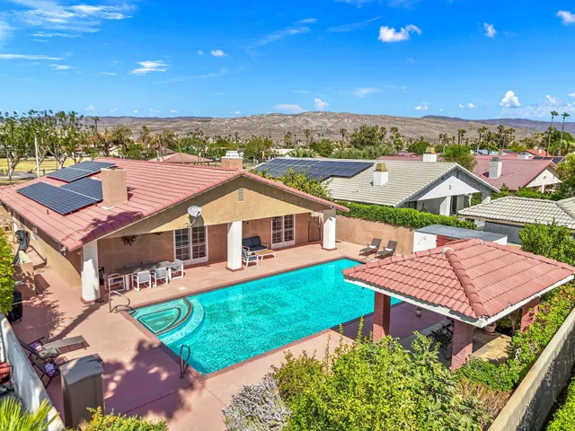 an aerial view of a house with a garden