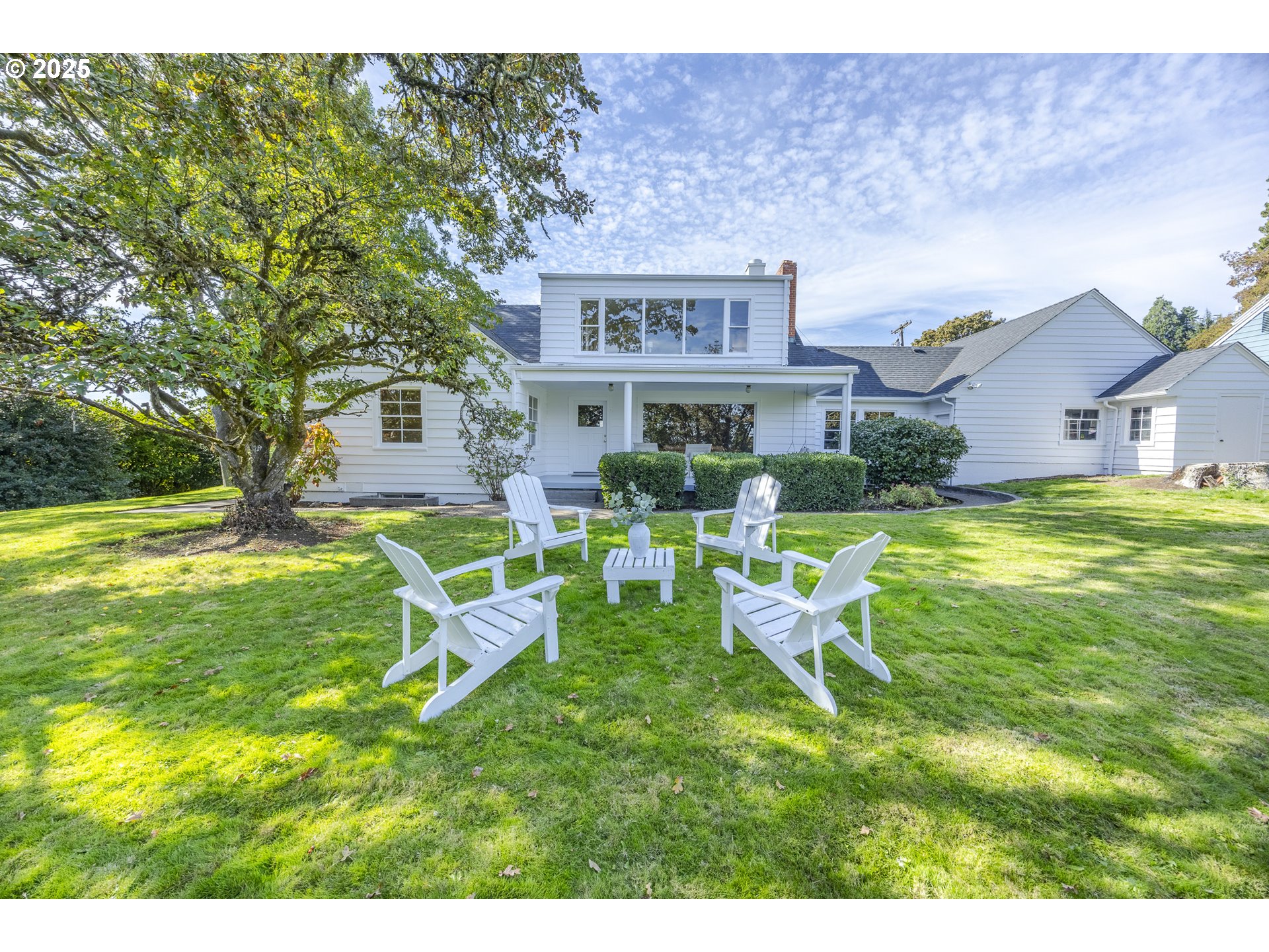 641 City View Boulevard Springfield, OR 97477 - Photo 41 of 48 a view of a house with a big yard potted plants and a large tree