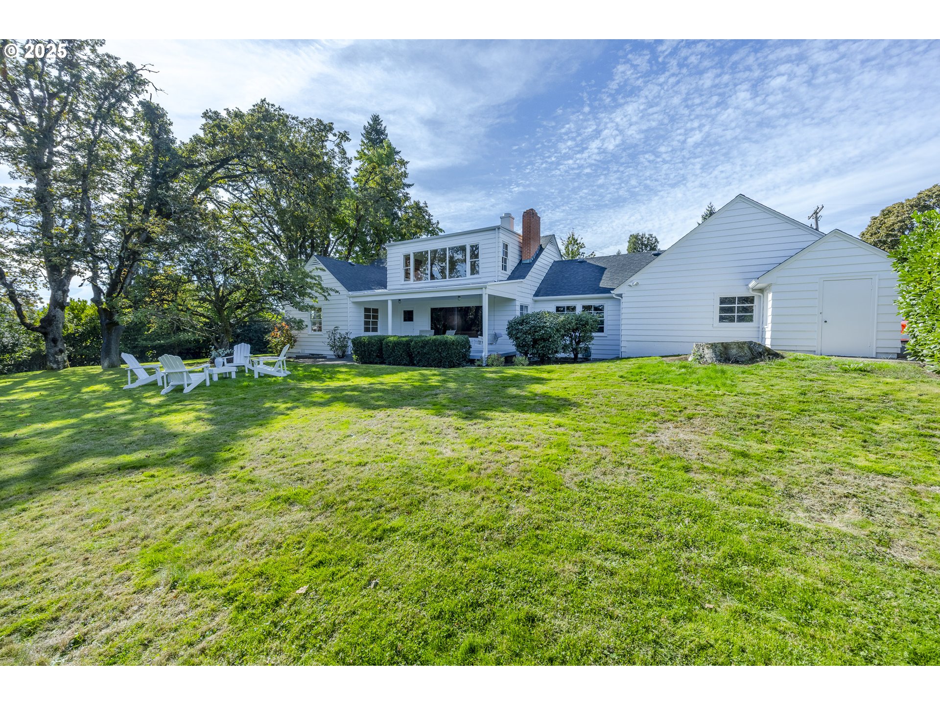 641 City View Boulevard Springfield, OR 97477 - Photo 42 of 48 a view of a house with a big yard and large trees