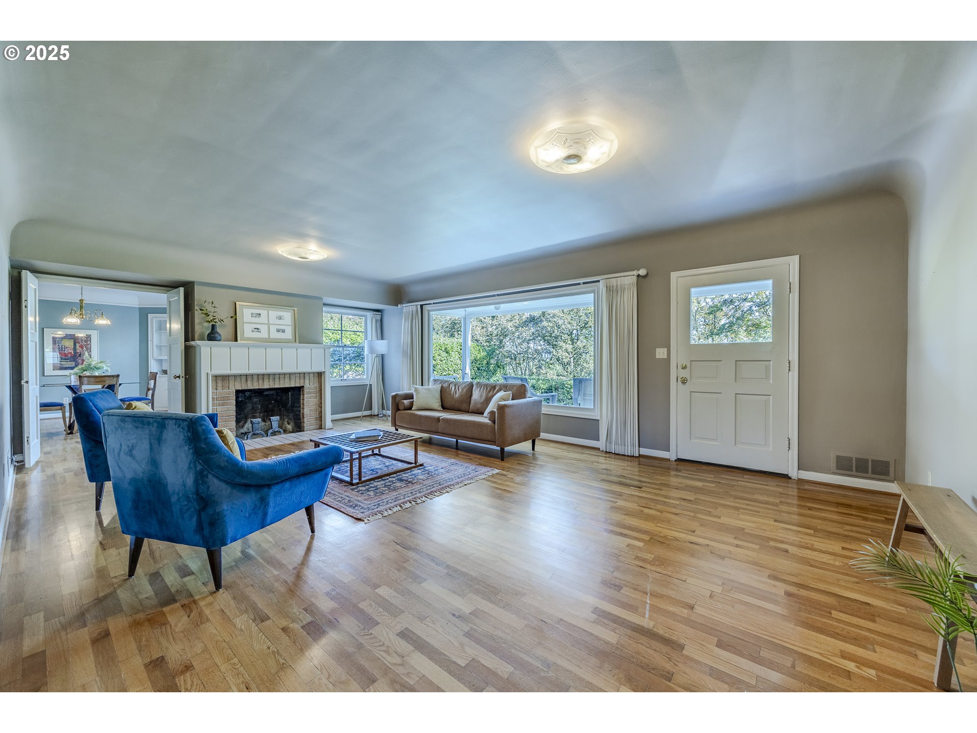 641 City View Boulevard Springfield, OR 97477 - Photo 8 of 48 a living room with furniture and a fireplace
