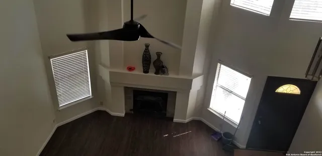 a view of an entryway with wooden floor and a window