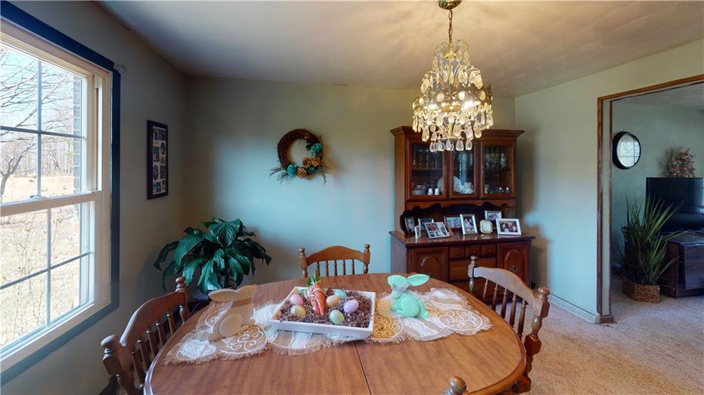 100 Eau Claire Road Boyers, PA 16020 - Photo 12 of 25 a view of a dining room with furniture window and flowerpot