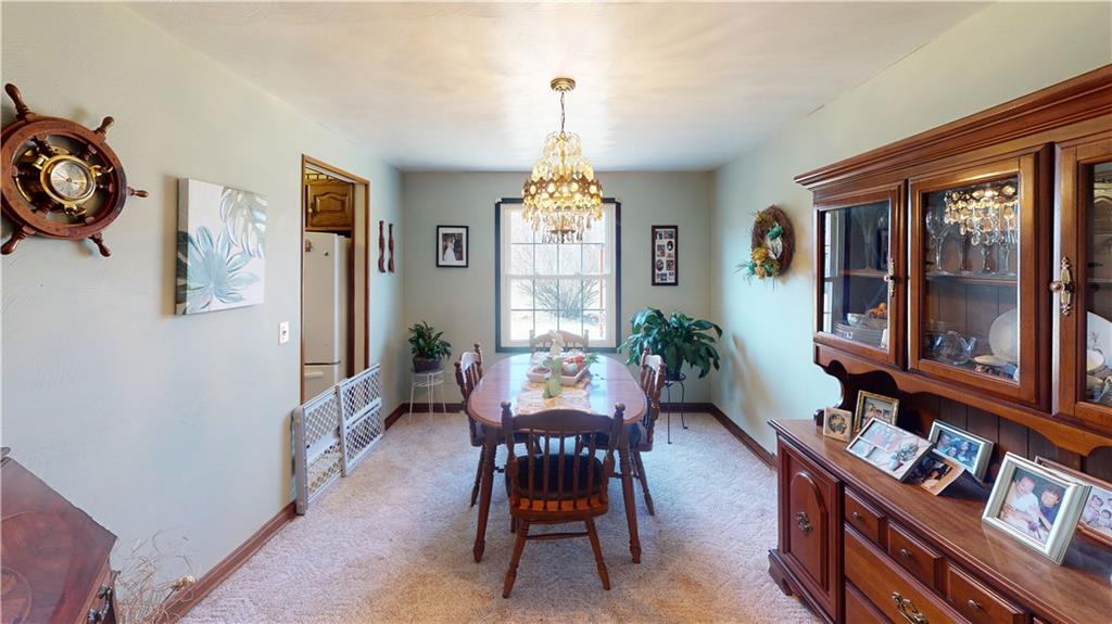 100 Eau Claire Road Boyers, PA 16020 - Photo 13 of 25 a dining room with furniture window and wooden floor