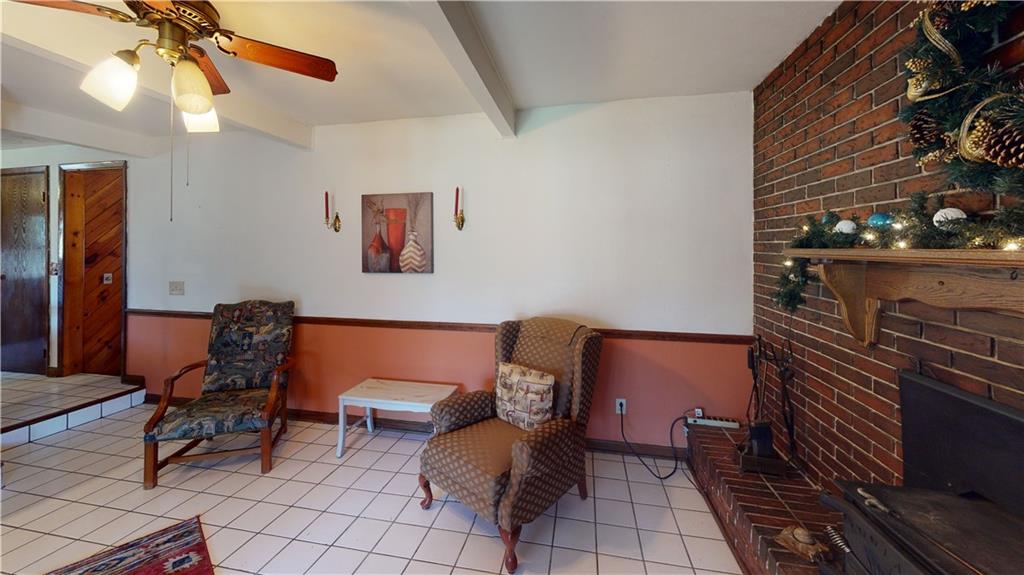 100 Eau Claire Road Boyers, PA 16020 - Photo 15 of 25 a living room with furniture and a dining table