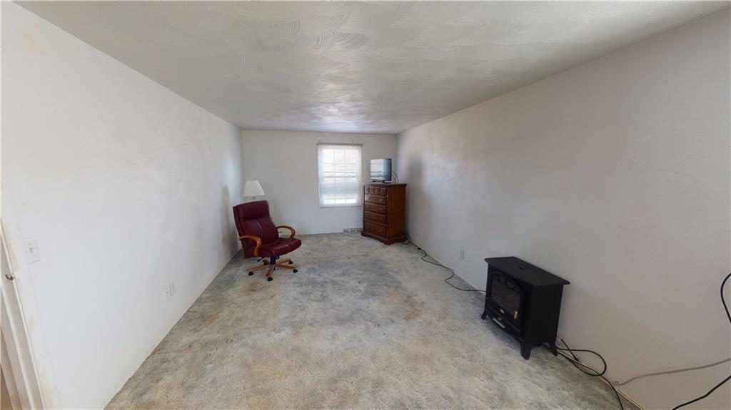 100 Eau Claire Road Boyers, PA 16020 - Photo 18 of 25 a living room with furniture and a air conditioner vent