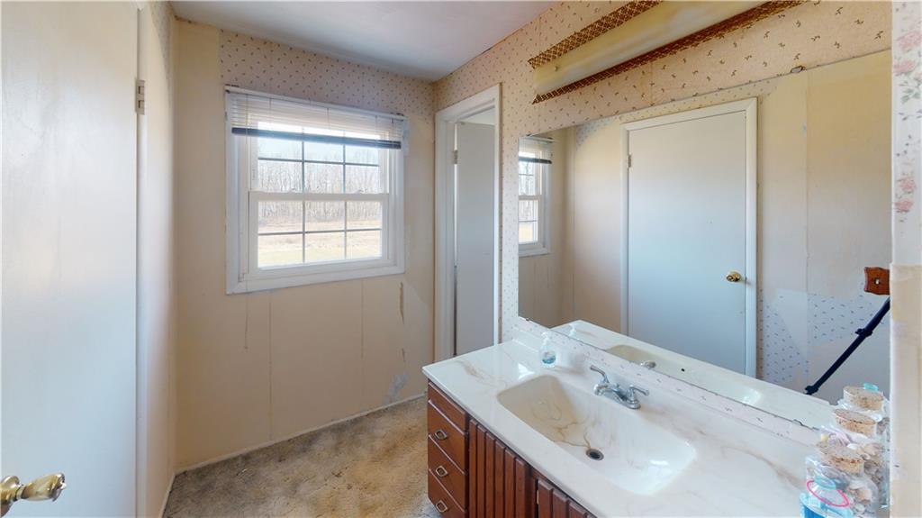 100 Eau Claire Road Boyers, PA 16020 - Photo 19 of 25 a bathroom with a sink and a mirror