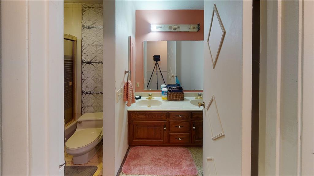 100 Eau Claire Road Boyers, PA 16020 - Photo 23 of 25 a bathroom with a toilet a sink and mirror