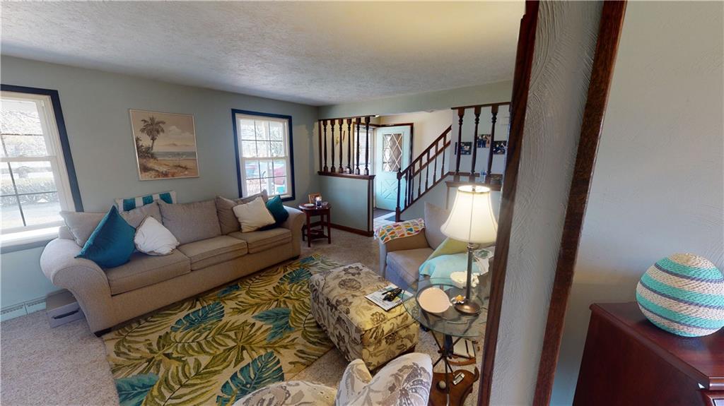 100 Eau Claire Road Boyers, PA 16020 - Photo 5 of 25 a living room with furniture and a window