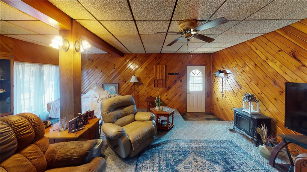 100 Eau Claire Road Boyers, PA 16020 - Photo 10 of 25 a living room with furniture a ceiling fan and a rug