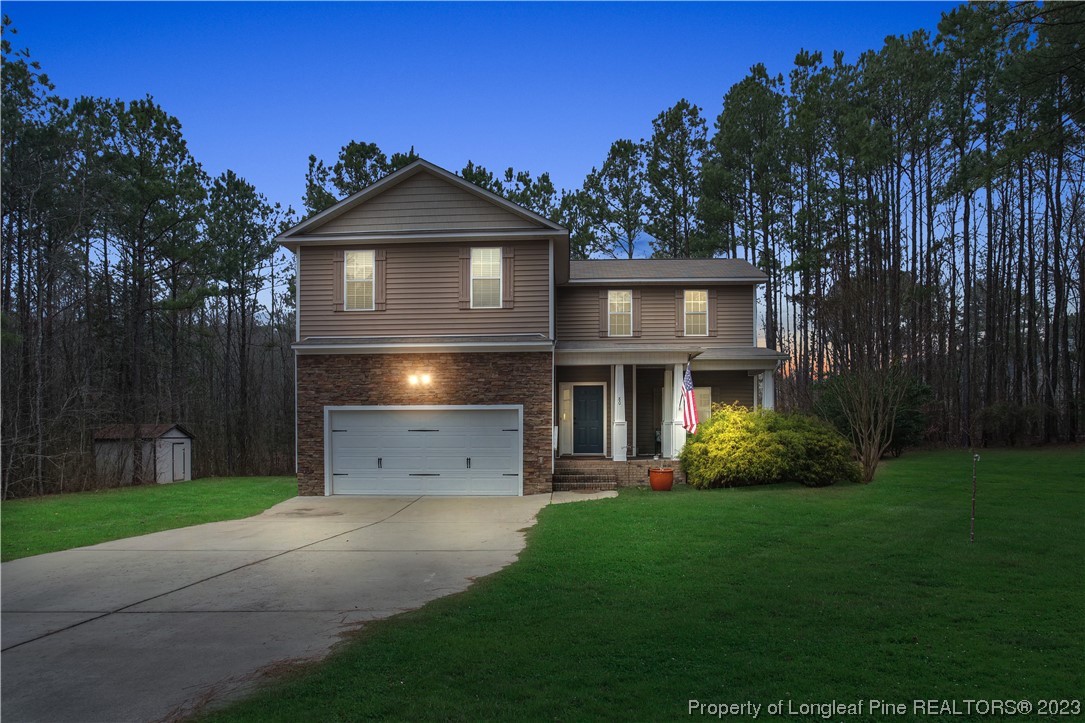 80 Valor Circle Bunnlevel, NC 28323 - Photo 1 of 49 a view of a house with brick walls and a yard with plants