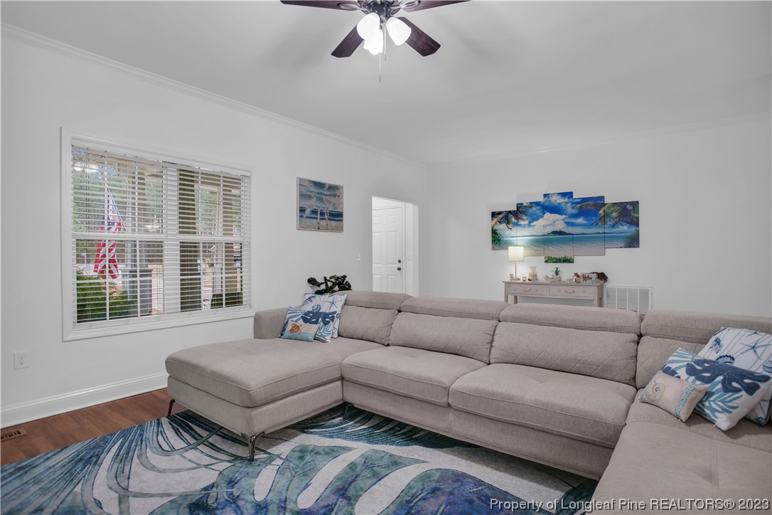 80 Valor Circle Bunnlevel, NC 28323 - Photo 13 of 49 a living room with furniture and a large window