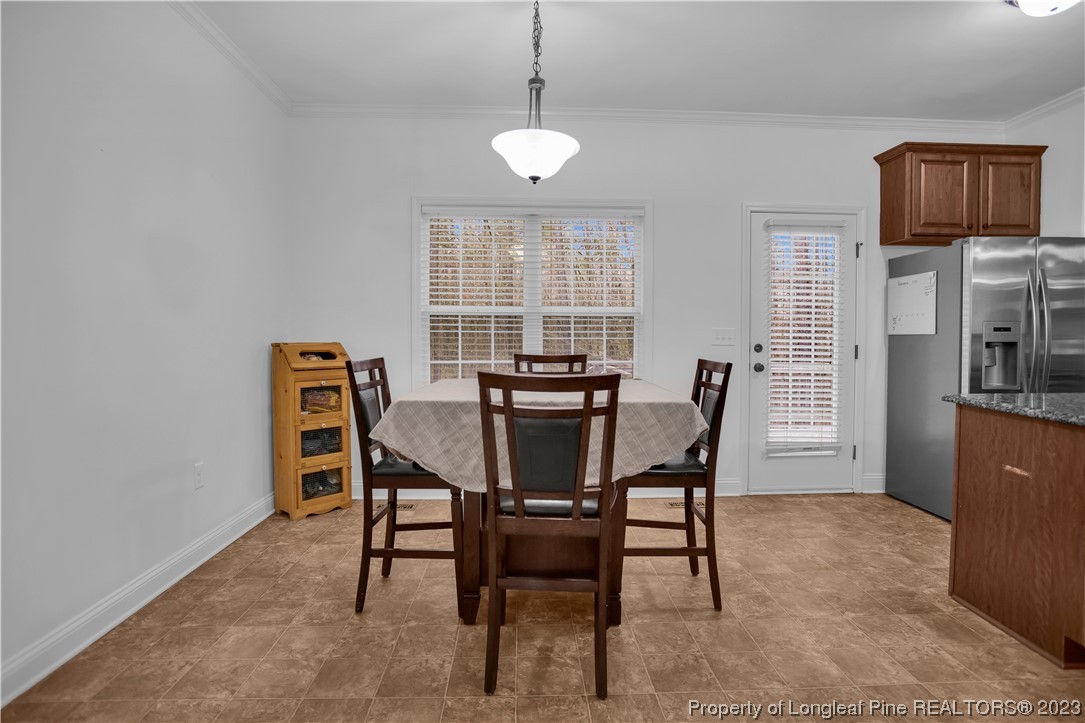80 Valor Circle Bunnlevel, NC 28323 - Photo 16 of 49 a dining room with furniture and window