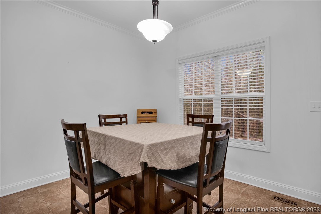 80 Valor Circle Bunnlevel, NC 28323 - Photo 19 of 49 a view of a dining room with furniture window and wooden floor