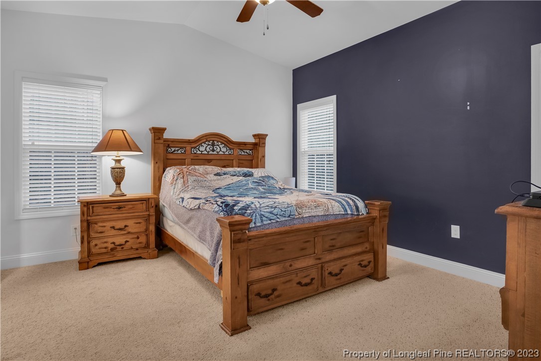 80 Valor Circle Bunnlevel, NC 28323 - Photo 24 of 49 a bed sitting in a bedroom next to a window