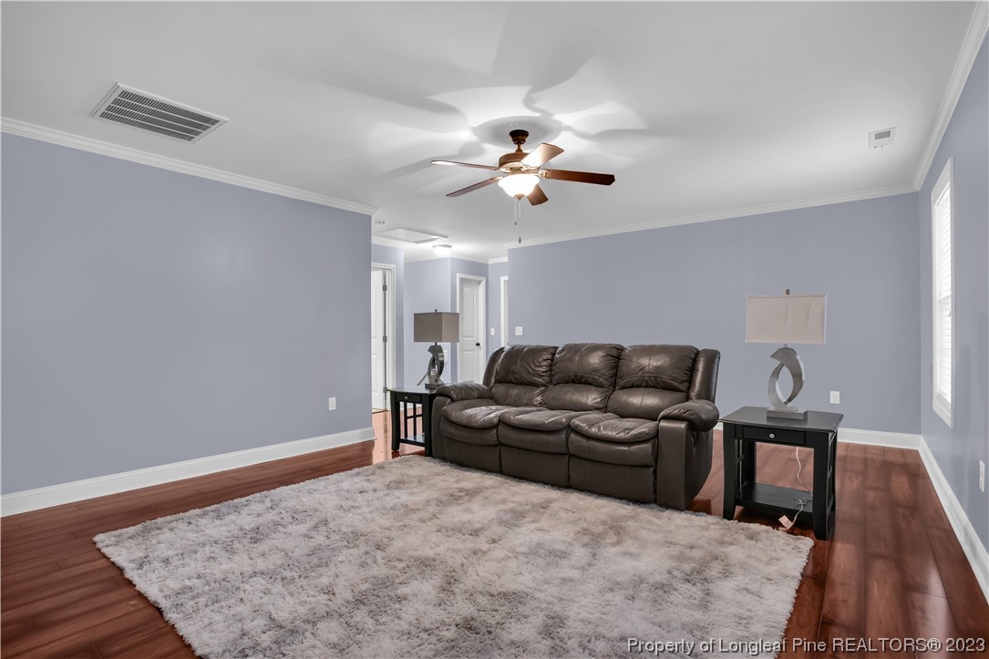 80 Valor Circle Bunnlevel, NC 28323 - Photo 32 of 49 a living room with furniture and wooden floor