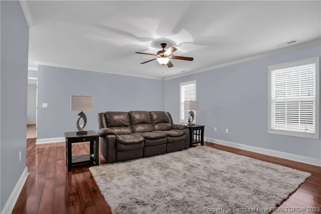 80 Valor Circle Bunnlevel, NC 28323 - Photo 33 of 49 a living room with furniture and wooden floor