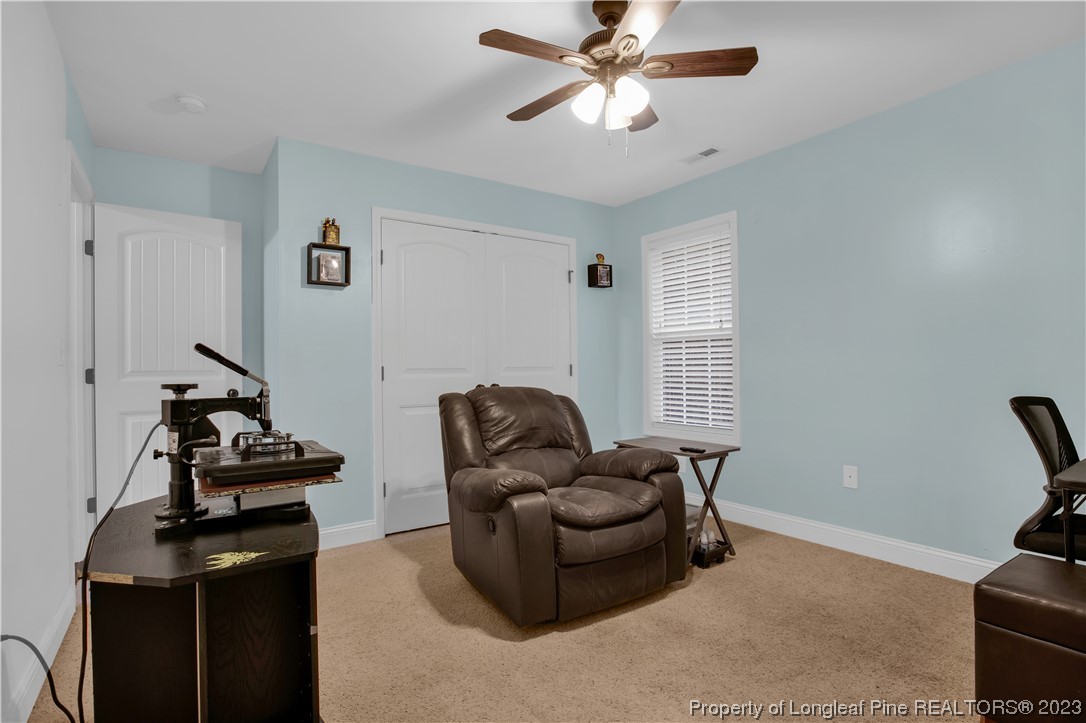 80 Valor Circle Bunnlevel, NC 28323 - Photo 36 of 49 a living room with furniture and a window