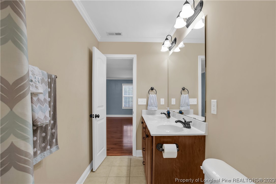 80 Valor Circle Bunnlevel, NC 28323 - Photo 38 of 49 a bathroom with a sink a toilet and shower