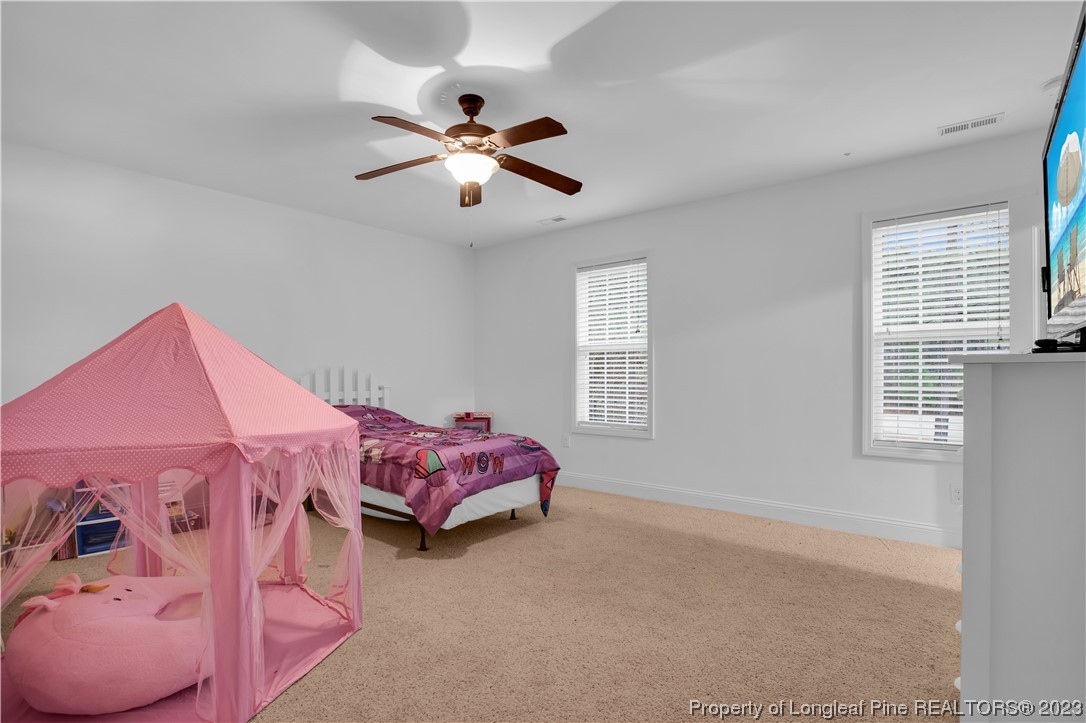 80 Valor Circle Bunnlevel, NC 28323 - Photo 42 of 49 a bed room with a bed and a window