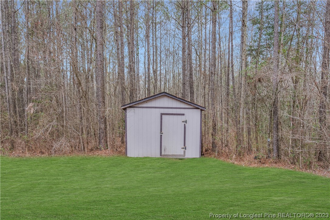 80 Valor Circle Bunnlevel, NC 28323 - Photo 48 of 49 a backyard of a house with lots of green space