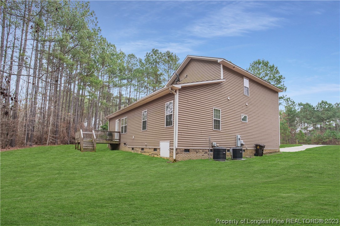 80 Valor Circle Bunnlevel, NC 28323 - Photo 49 of 49 a backyard of a house with lots of green space
