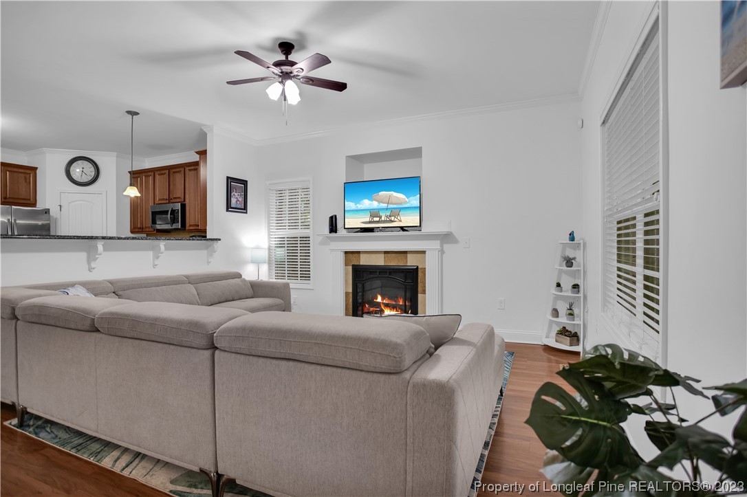 80 Valor Circle Bunnlevel, NC 28323 - Photo 7 of 49 a living room with furniture a fireplace and a flat screen tv