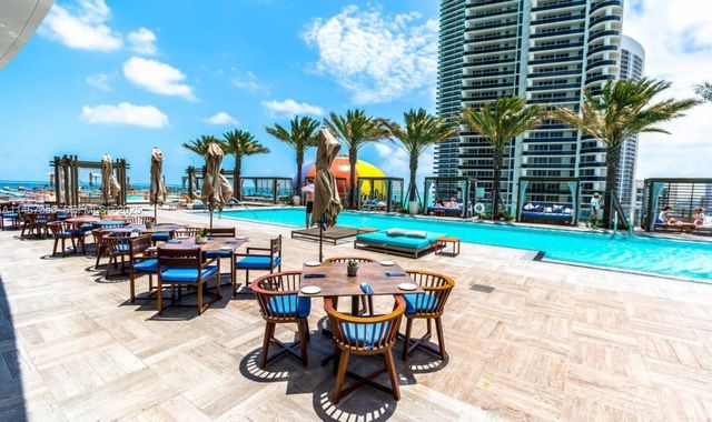 a view of a fountain with a patio