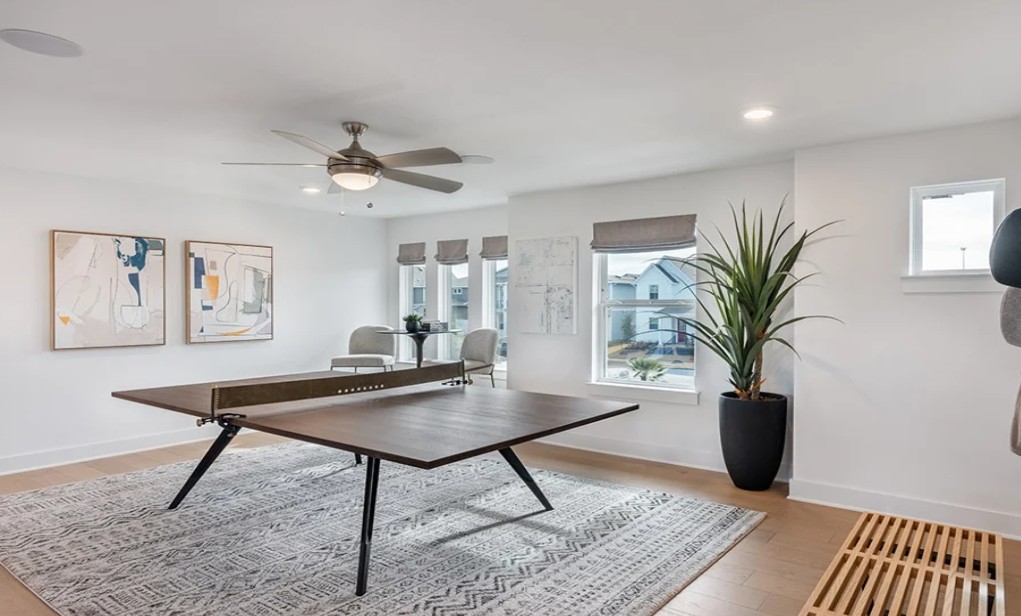 8608 Turaco Trail Austin, TX 78744 - Photo 12 of 20 a living room with furniture and a potted plant