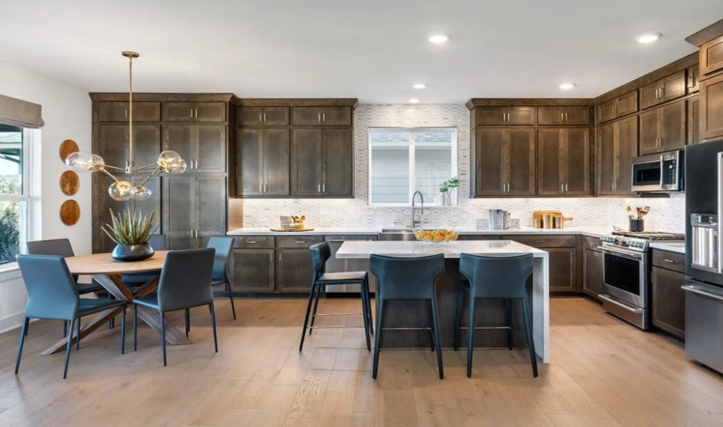 8608 Turaco Trail Austin, TX 78744 - Photo 2 of 20 a living room with stainless steel appliances kitchen island granite countertop furniture and a view of kitchen