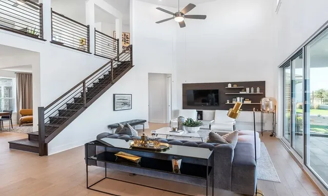 a living room with stainless steel appliances kitchen island granite countertop furniture and a view of kitchen