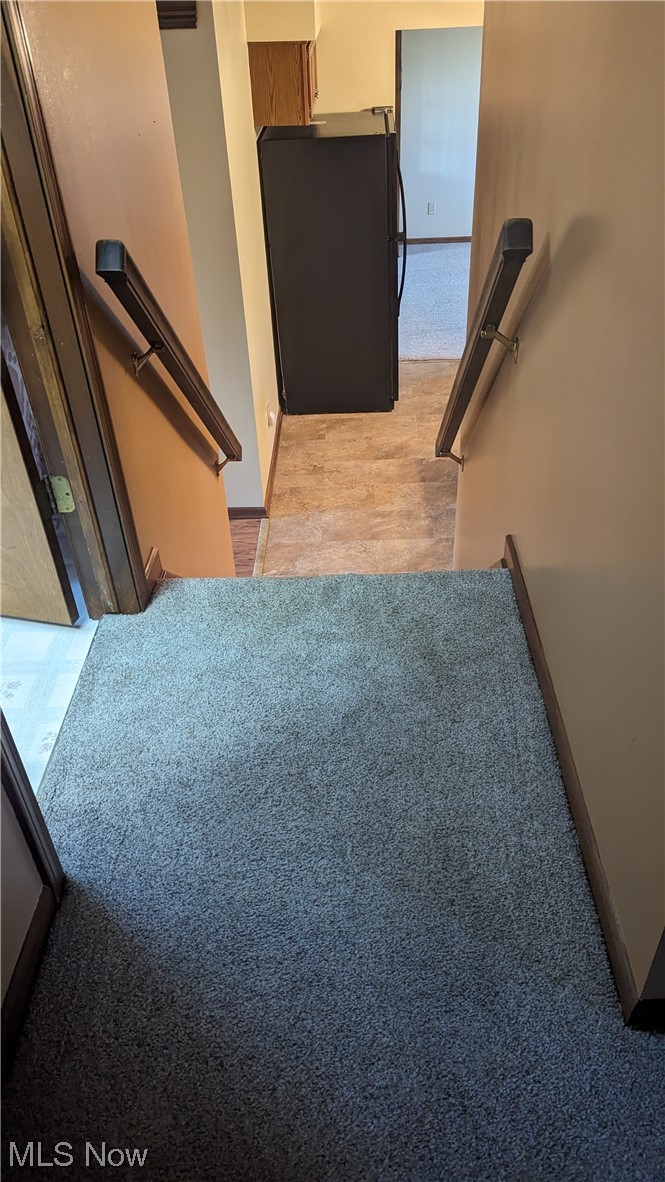 1531 Bravado Road Southwest Canton, OH 44706 - Photo 17 of 31 Stairway featuring light hardwood / wood-style flooring