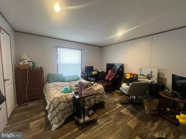 a bed room with a bed and a tv