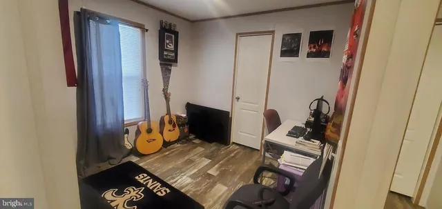 a view of living room with furniture and a window
