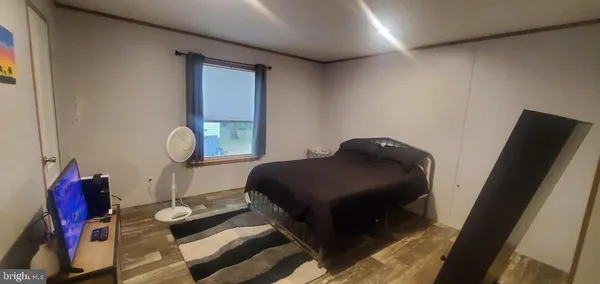 a bedroom with a bed and cabinets