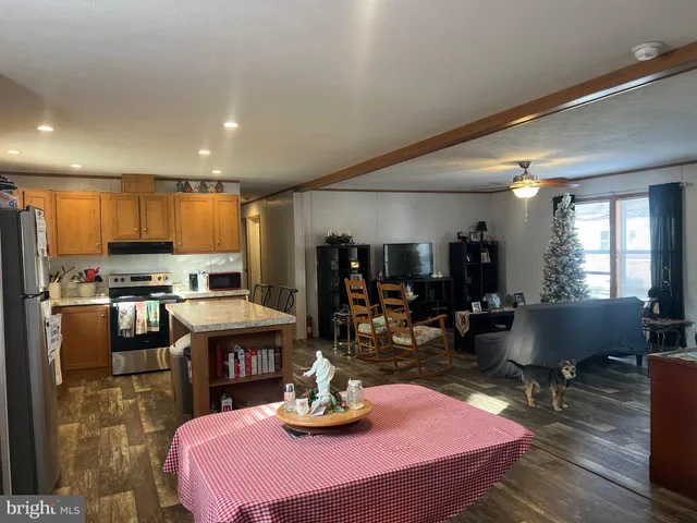 a kitchen with a sink appliances and cabinets