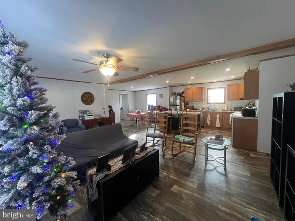 a living room with furniture and a chandelier