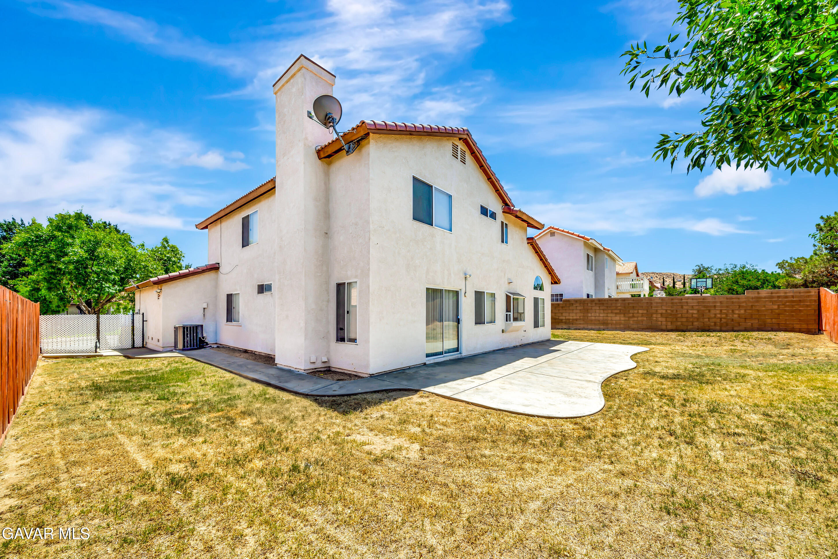 3115 Crowne Drive Palmdale, CA 93551 - Photo 18 of 51 a view of a house with a yard