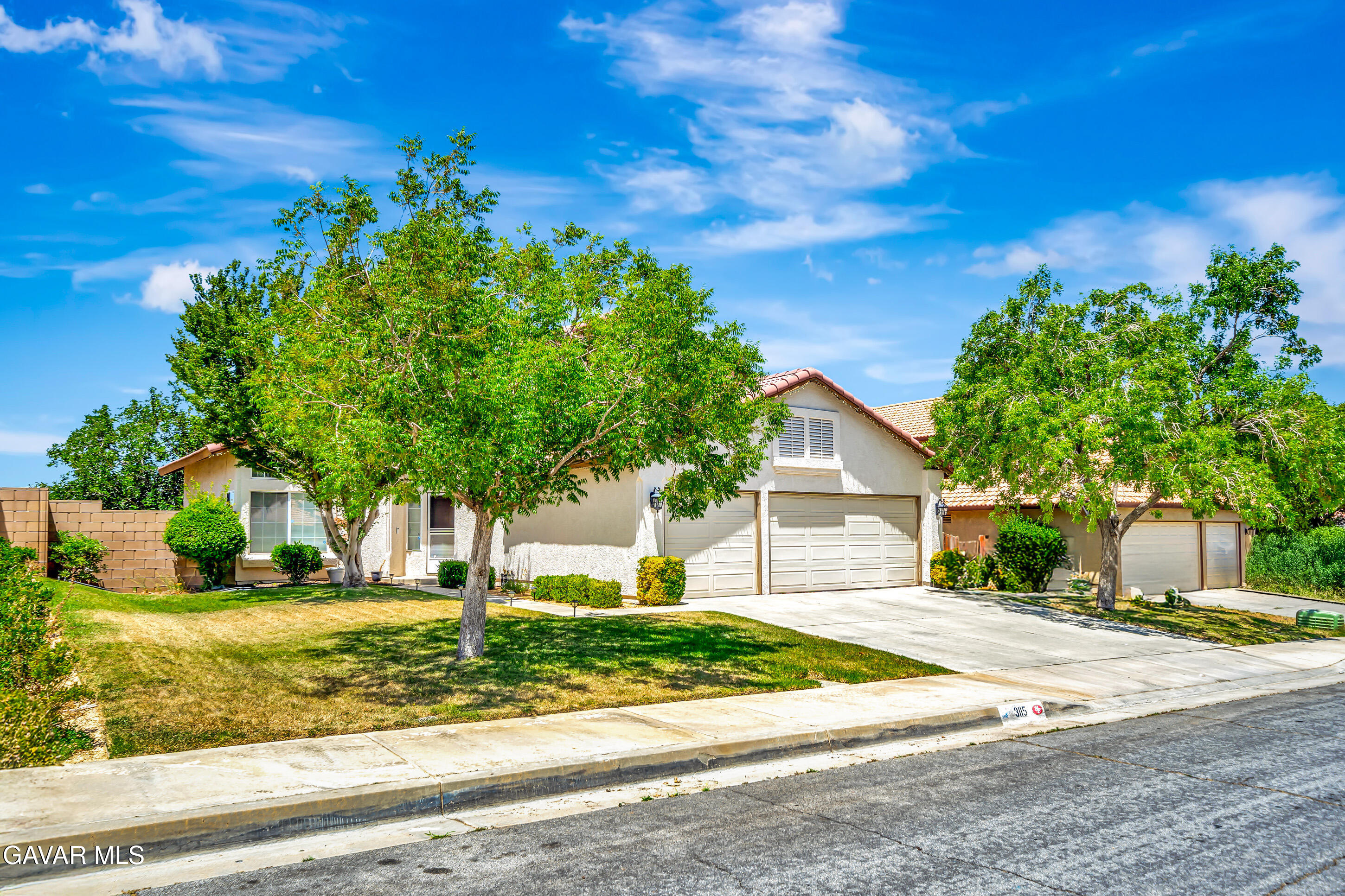 3115 Crowne Drive Palmdale, CA 93551 - Photo 20 of 51 a front view of a house with a yard
