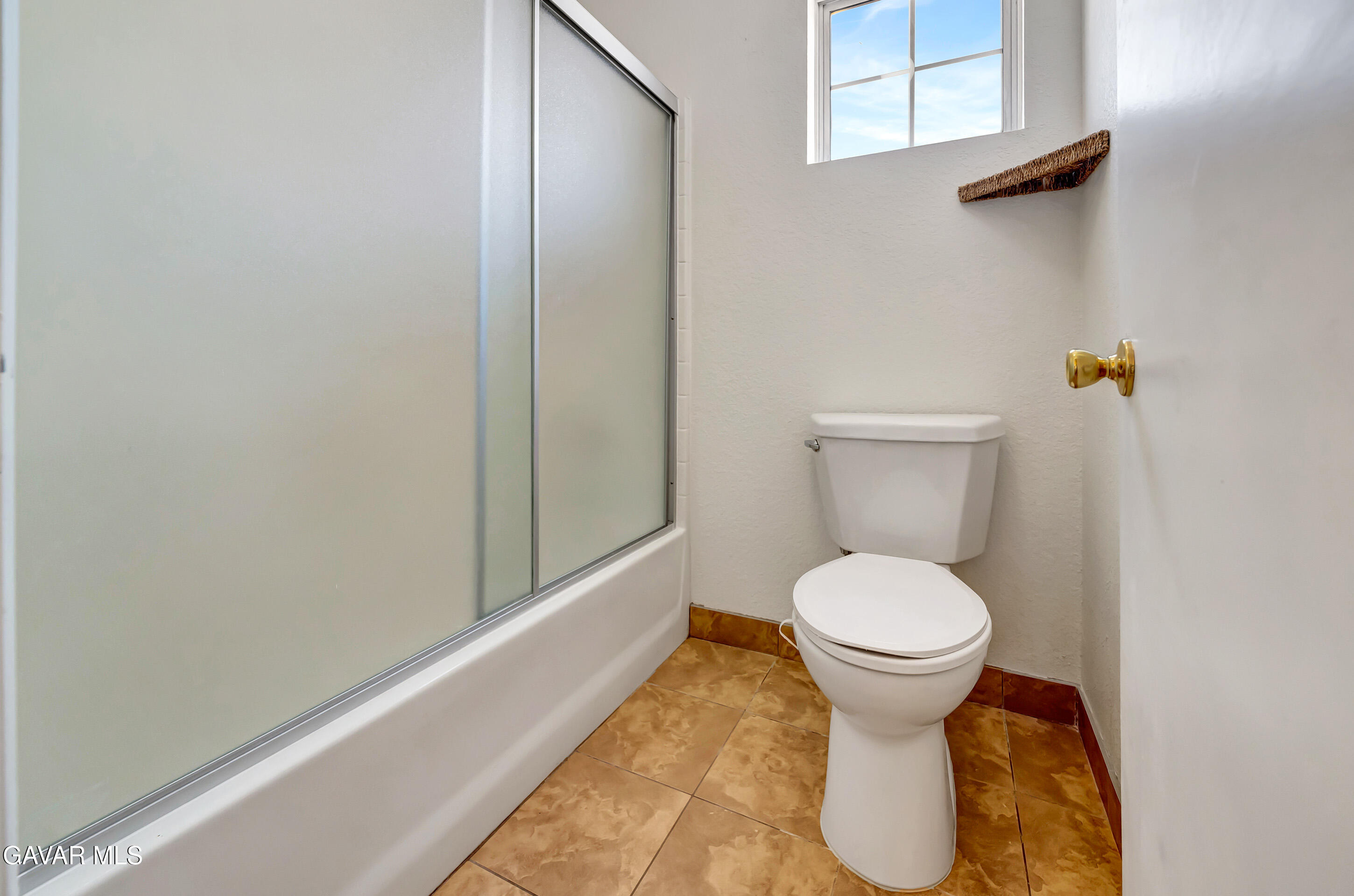 3115 Crowne Drive Palmdale, CA 93551 - Photo 24 of 51 a bathroom with a toilet and a vanity
