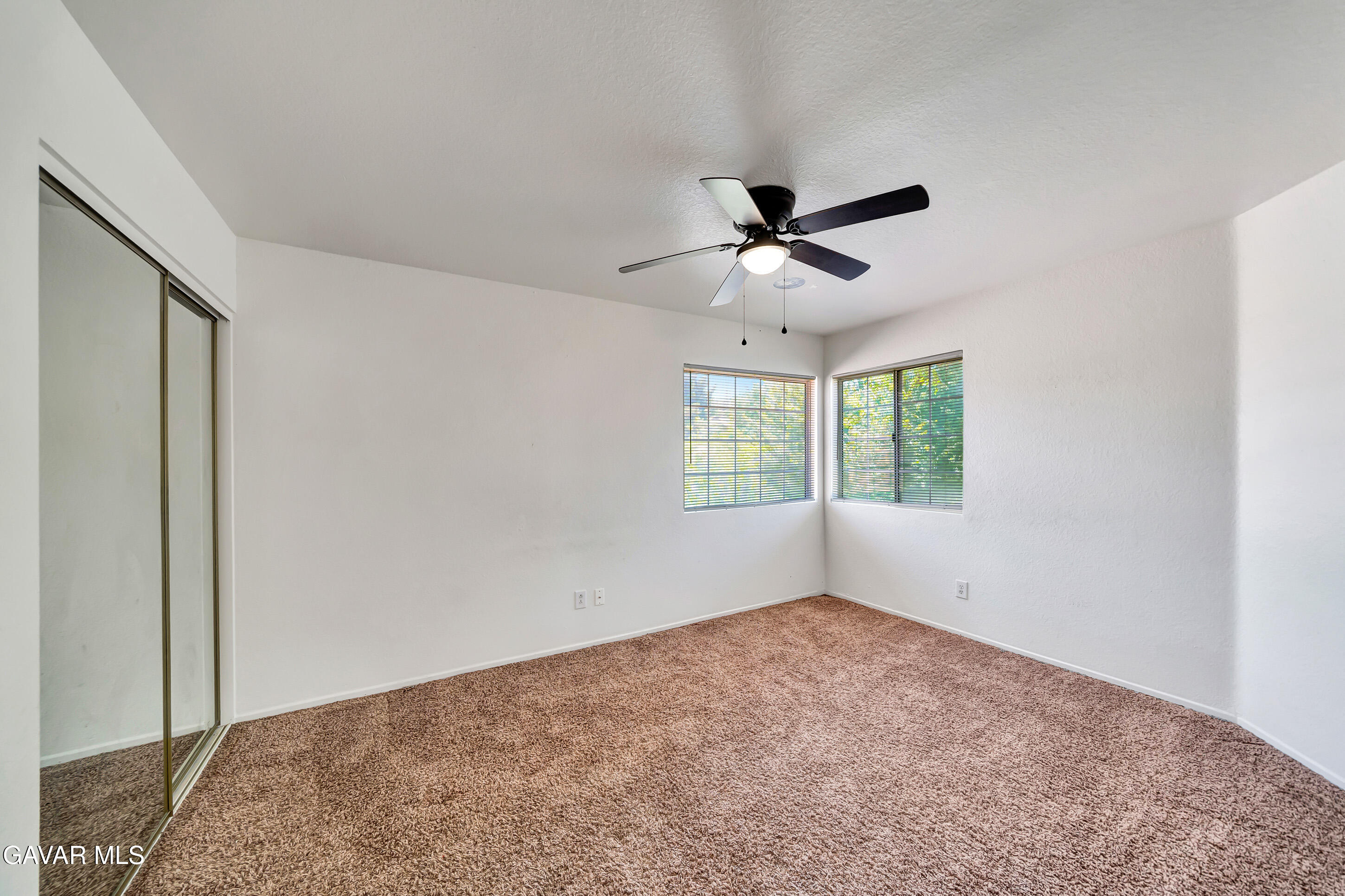 3115 Crowne Drive Palmdale, CA 93551 - Photo 25 of 51 a view of room with a ceiling fan and window