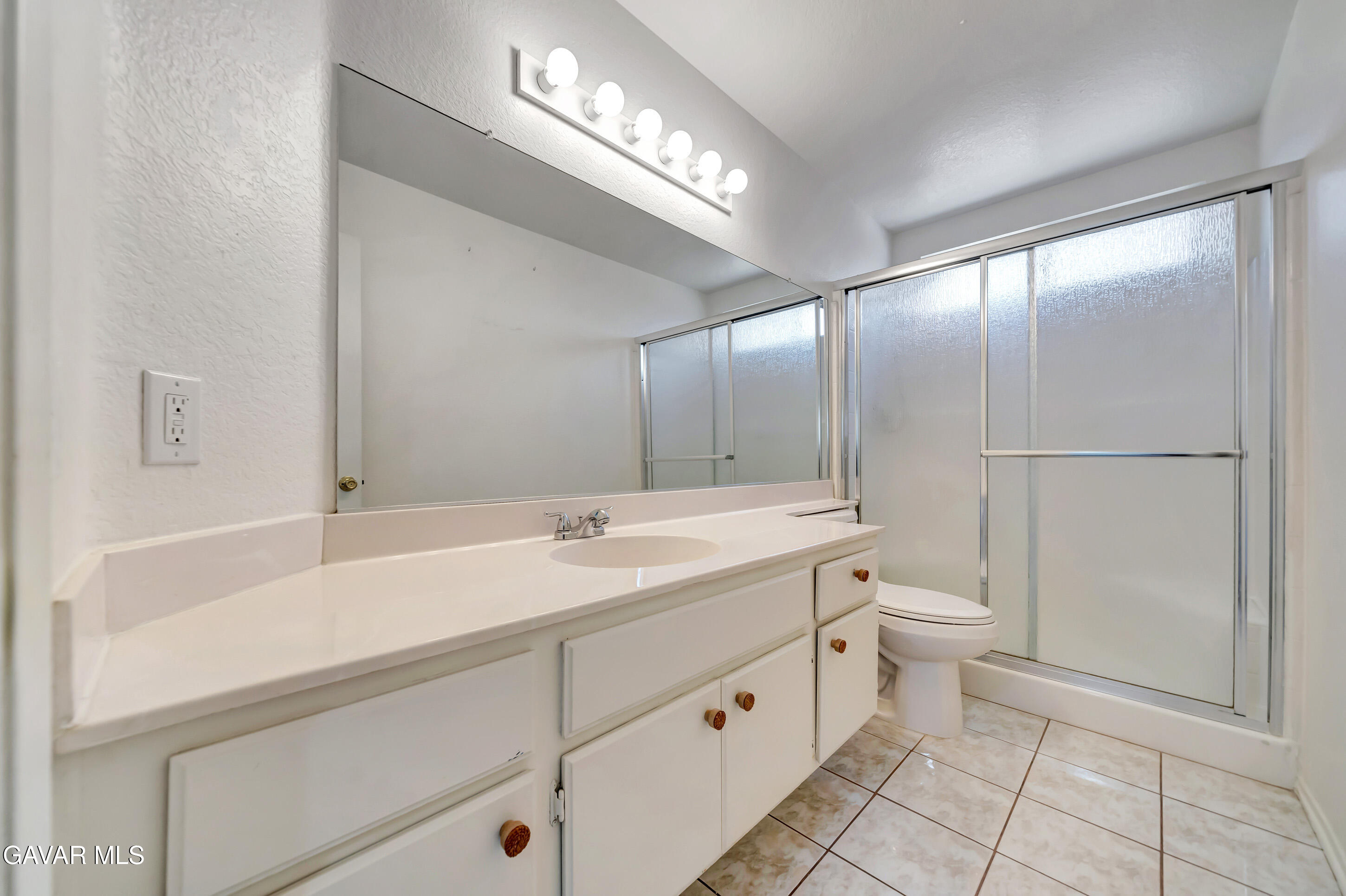 3115 Crowne Drive Palmdale, CA 93551 - Photo 33 of 51 a spacious bathroom with a double vanity sink toilet and a mirror