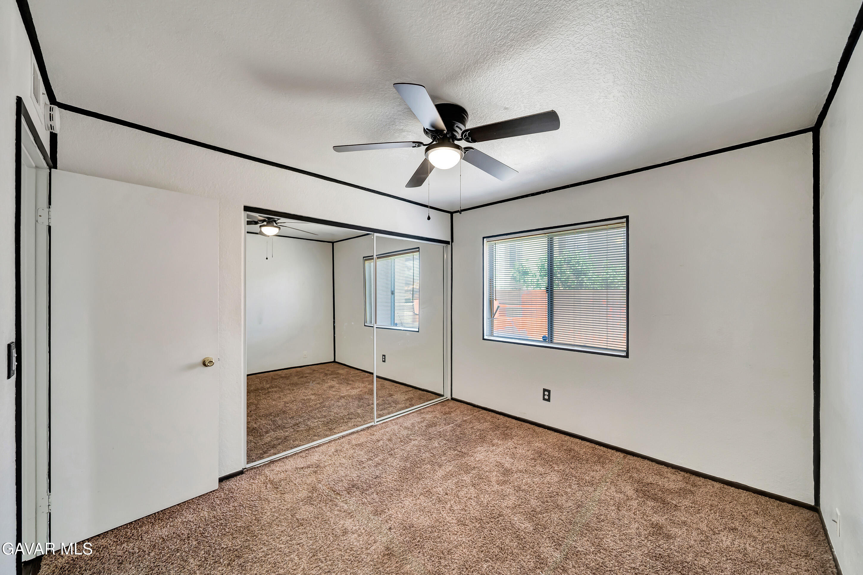 3115 Crowne Drive Palmdale, CA 93551 - Photo 34 of 51 a view of an empty room with a window