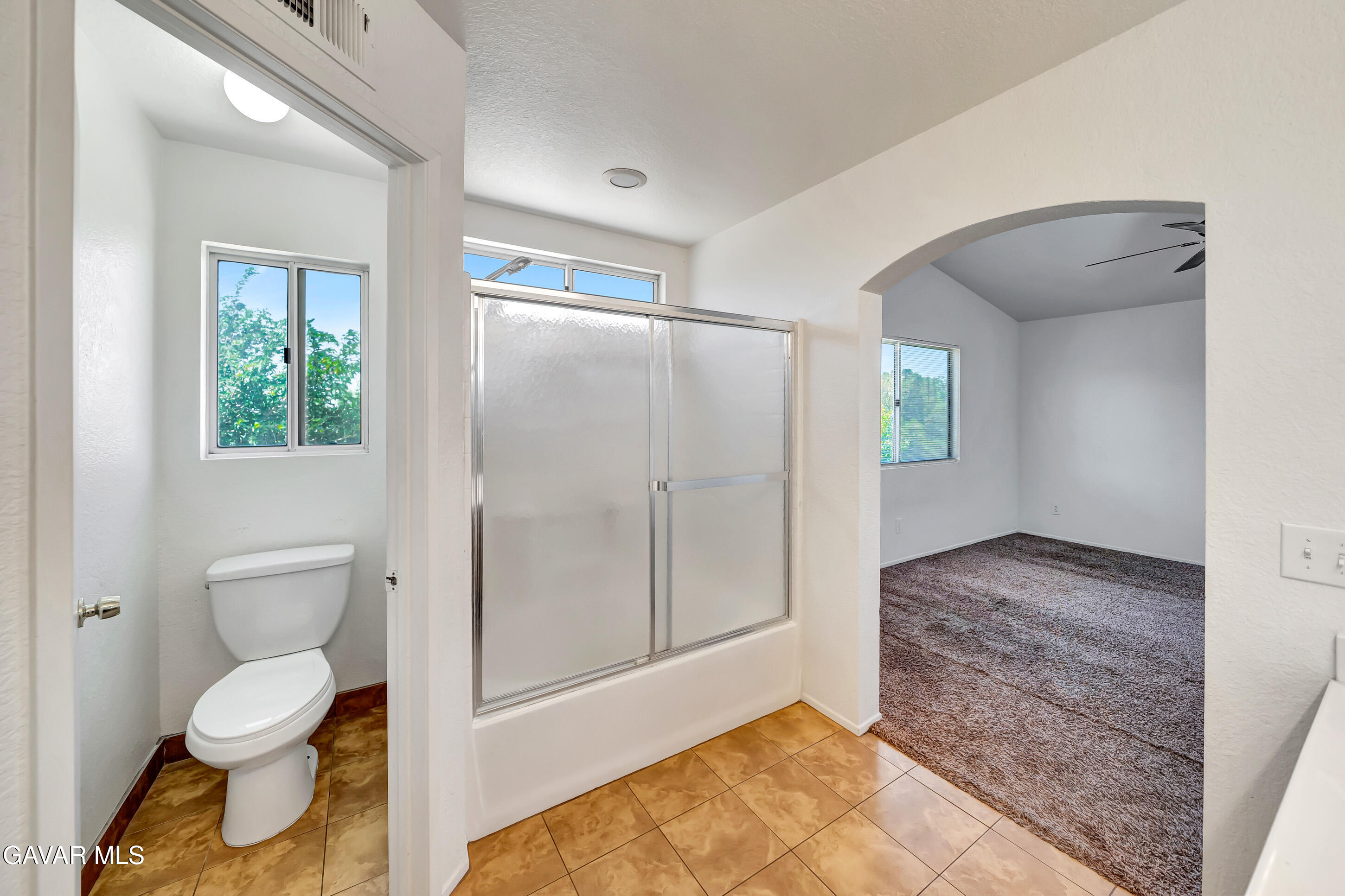 3115 Crowne Drive Palmdale, CA 93551 - Photo 45 of 51 a bathroom with a toilet and a shower